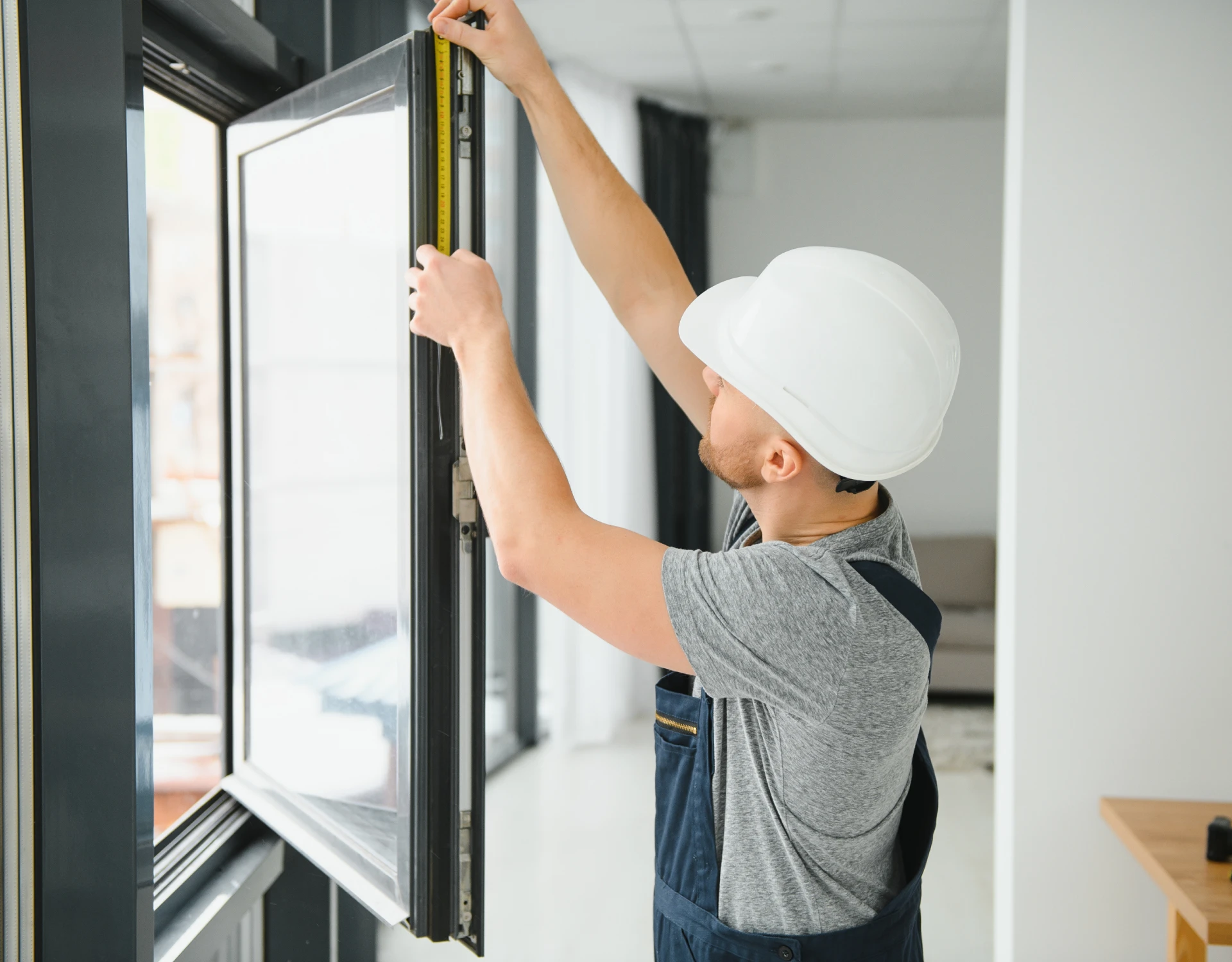 Man fitting new window frame